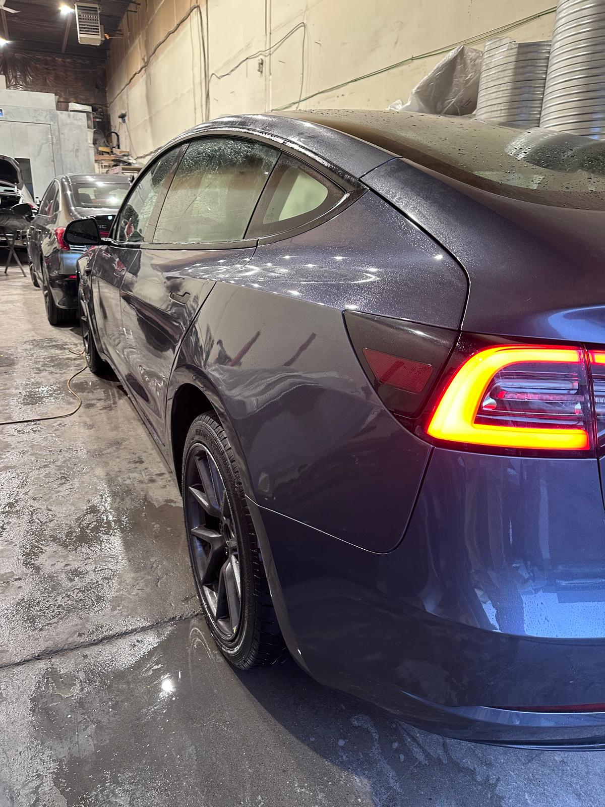 Repaired grey SUV with restored doors and body panels