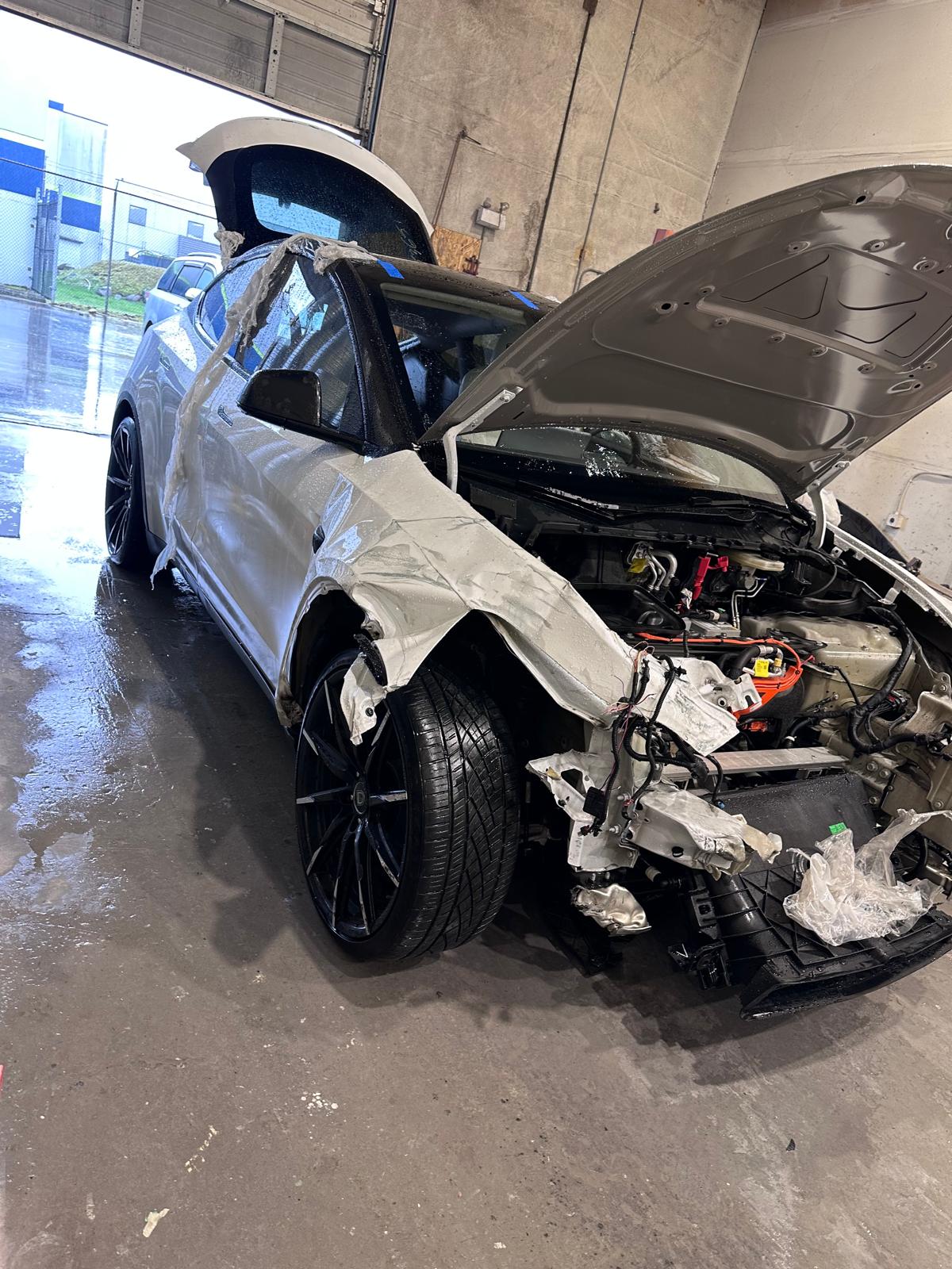 White SUV with extensive front-end collision damage